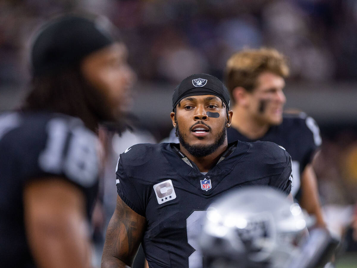 Raiders running back Josh Jacobs (8) looks to teammates before facing the Green Bay Packers dur ...