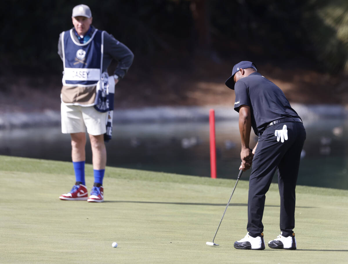 Harold Varner III of team 4Aces GC watches his putt on the 9th hole during the second round of ...