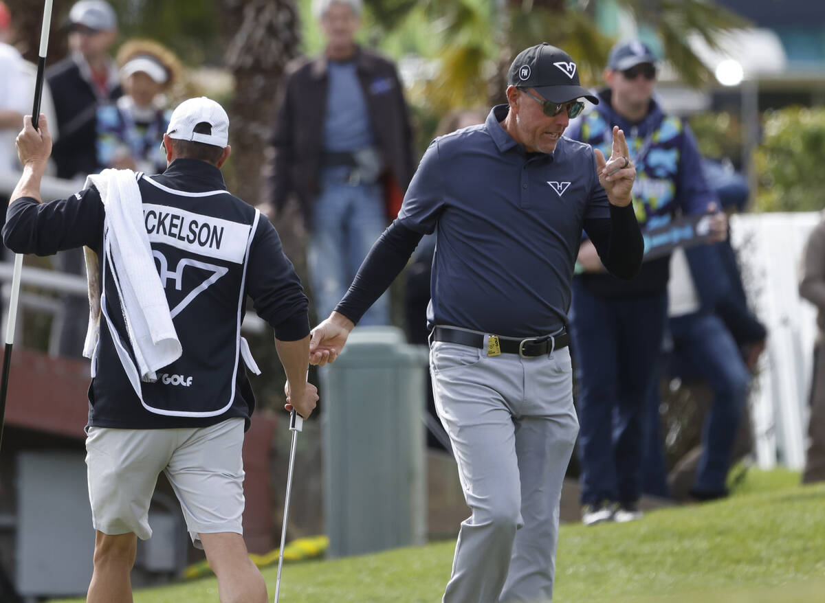Phil Mickelson of team HyFlyers GC acknowledges the crowd after putting in on the 18th green du ...