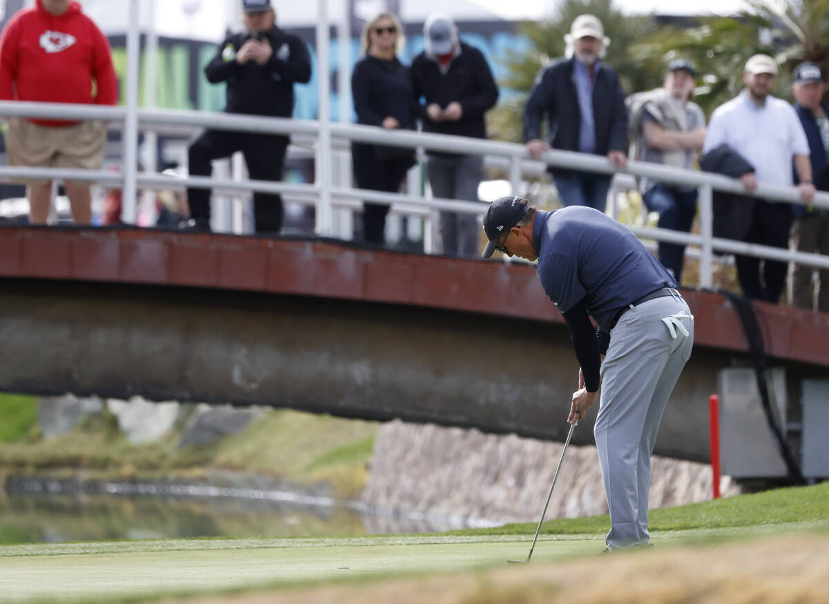 Phil Mickelson of team HyFlyers GC watches his putt on the 18th green during the second round o ...
