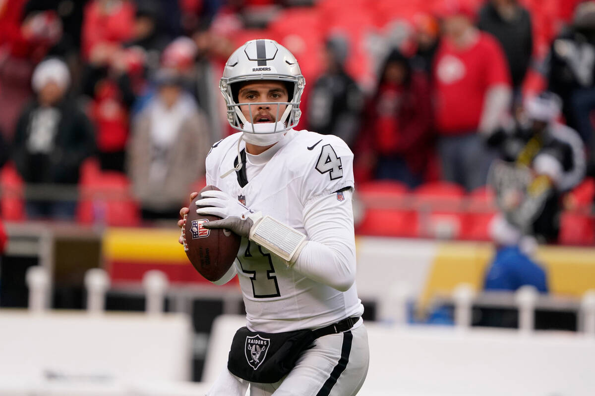 Las Vegas Raiders quarterback Aidan O'Connell (4) warms up before the start of an NFL football ...