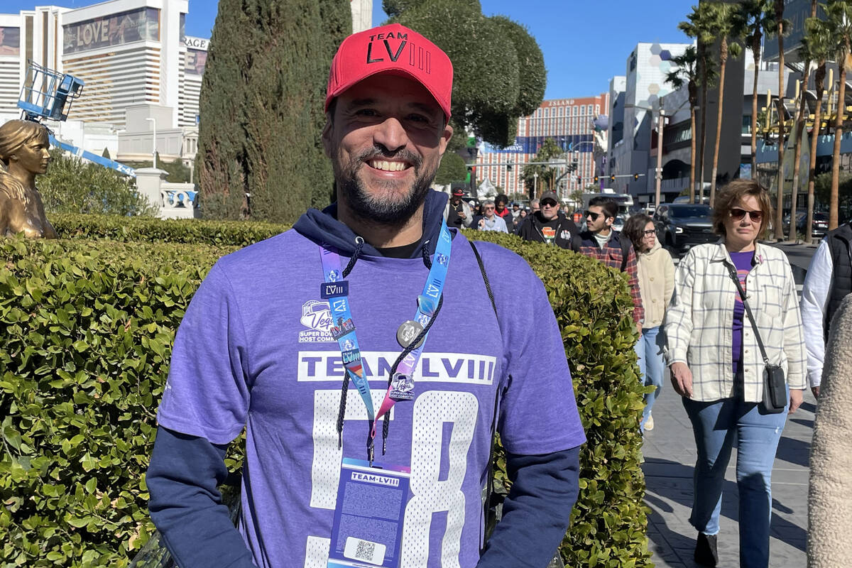 Las Vegas Super Bowl LVIII Host Committee volunteer Abel Pina on the Strip on Saturday, Feb. 10 ...