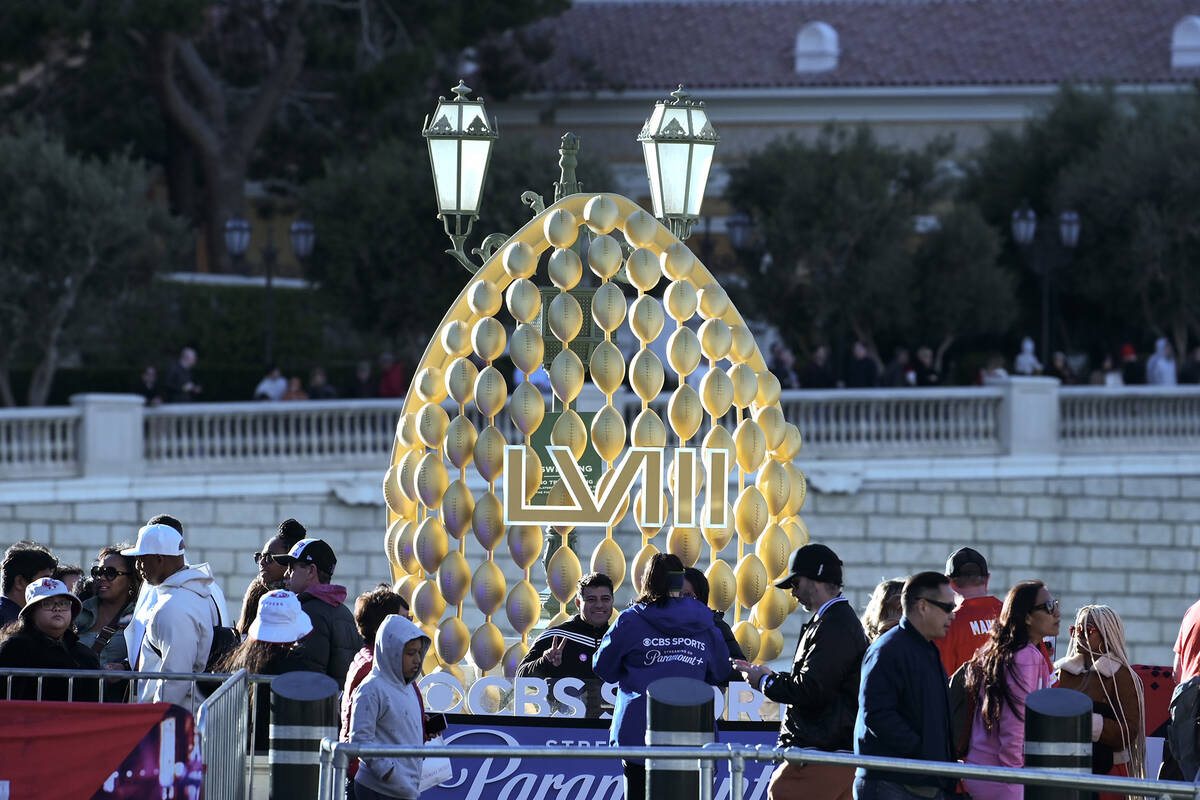 A football display is seen in front of Bellagio on the Strip the day before Super Bowl LVIII Sa ...