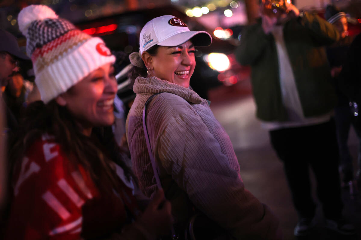 San Francisco 49ers fans dance to performers along Las Vegas Boulevard Saturday, Feb. 10, 2024, ...
