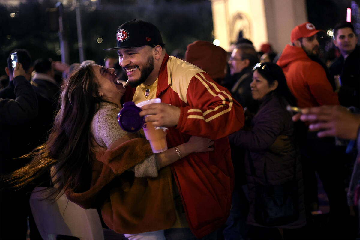 San Francisco 49ers fans Denise Uribe, of Mexico, and Jose Marquez, of California, who met for ...