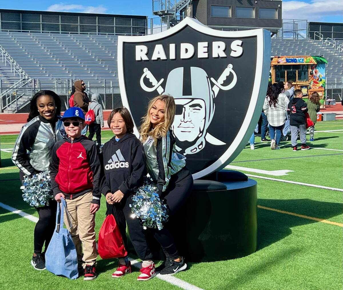 Families mingled with players, cheerleaders and mascots Saturday morning during the NFL Play Fo ...