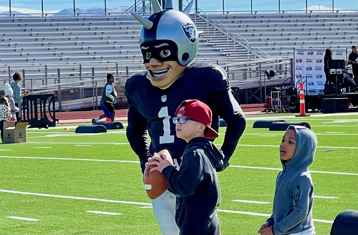 Families mingled with players, cheerleaders and mascots Saturday morning during the NFL Play Fo ...