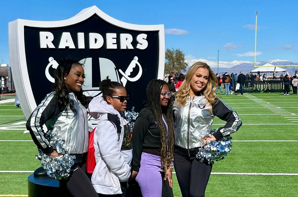 Families mingled with players, cheerleaders and mascots Saturday morning during the NFL Play Fo ...