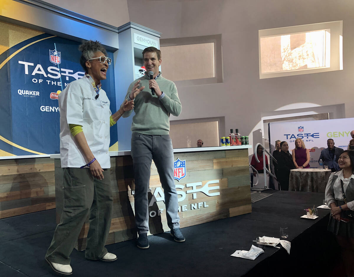 Football legend Eli Manning and celebrated Chef Carla Hall take the stage at Taste of the NFL. ...