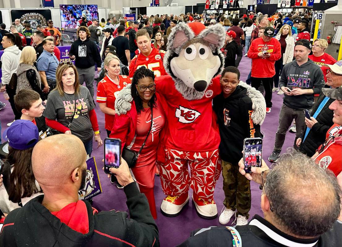The Kansas City Chiefs' mascot, K.C. Wolf, poses with Chiefs fans at the Super Bowl Experience ...