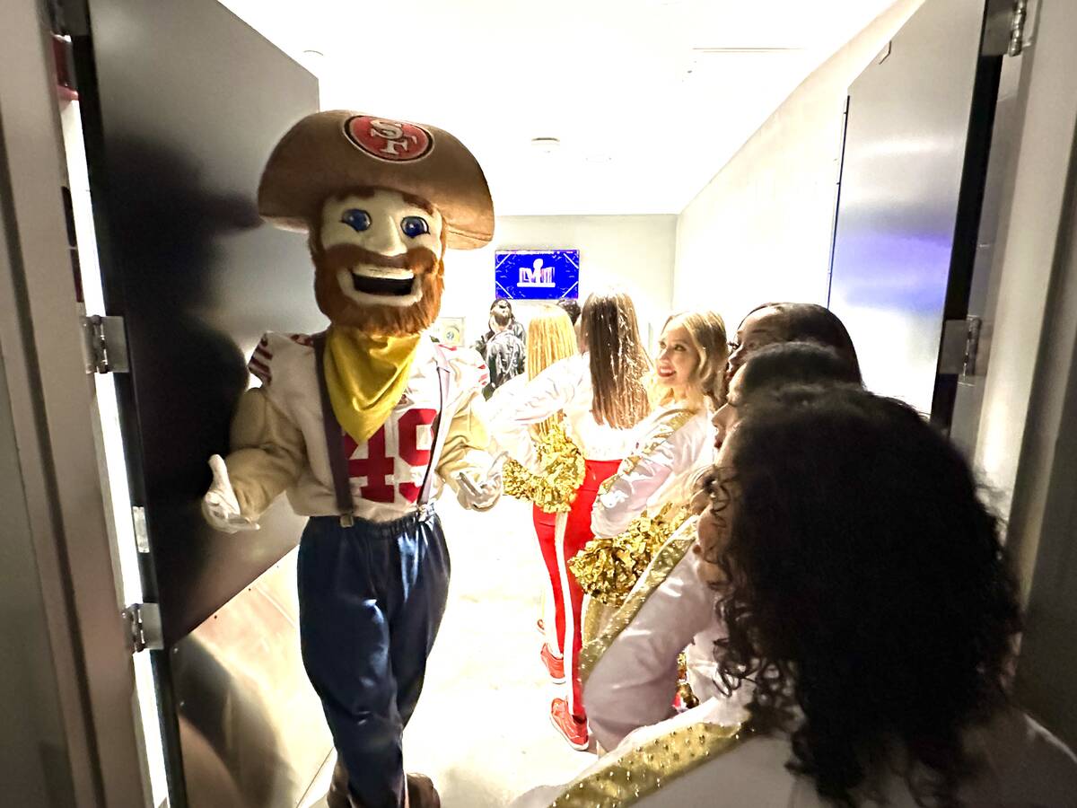 49ers mascot Sourdough Sam and cheerleaders wait for an elevator at Allegiant Stadium in Las Ve ...