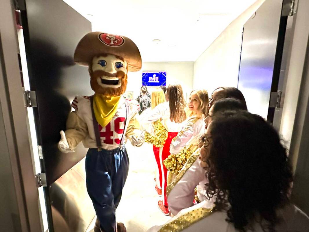 49ers mascot Sourdough Sam and cheerleaders wait for an elevator at Allegiant Stadium in Las Ve ...