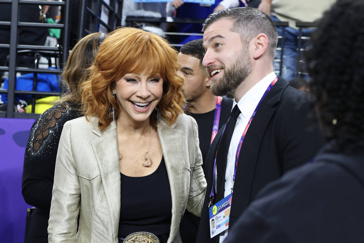 Reba McEntire and Justin Timberlake talk before the start of Super Bowl 58 Sunday, February 11, ...