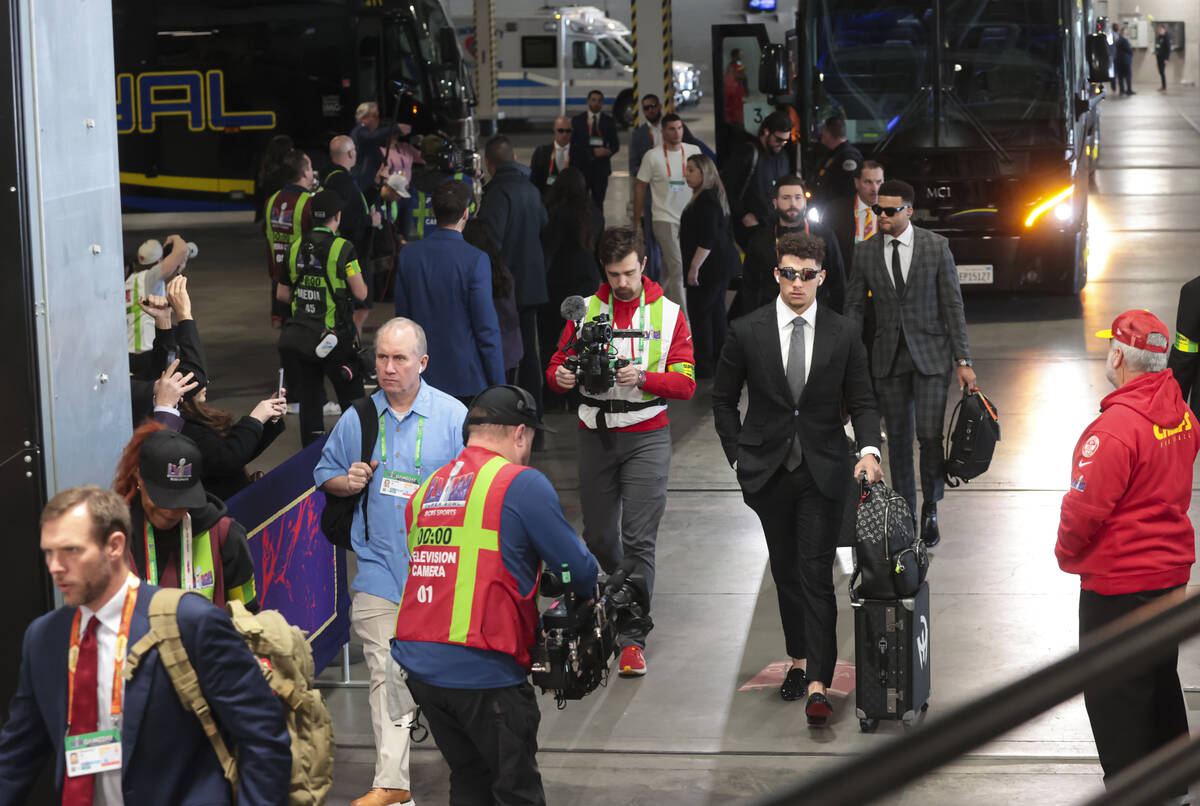 Kansas City Chiefs quarterback Patrick Mahomes, right, arrives for Super Bowl 58 at Allegiant S ...