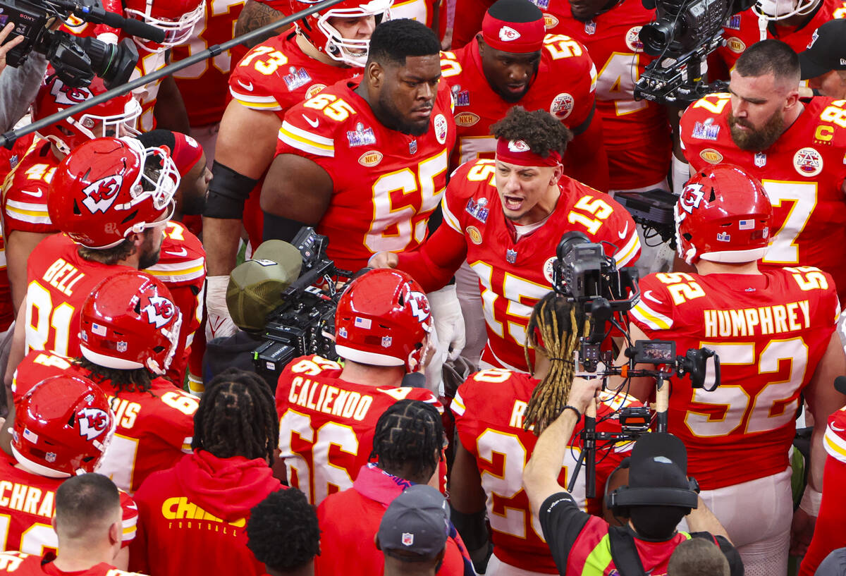 The Kansas City Cheifs gather before the start of Super Bowl 58 at Allegiant Stadium on Sunday, ...