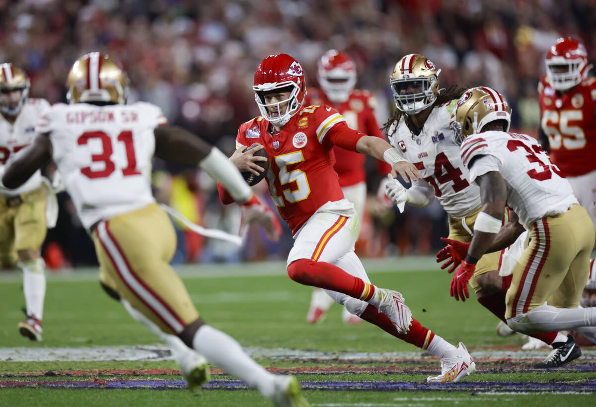 Kansas City Chiefs quarterback Patrick Mahomes (15) runs the ball against San Francisco 49ers d ...