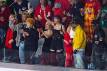 Taylor Swift, center, cheers before the start of Super Bowl 58 at Allegiant Stadium on Sunday, ...