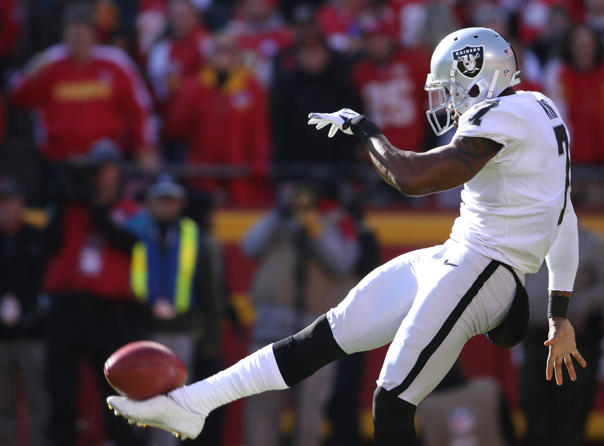 Former Oakland Raiders punter Marquette King (7) punts the football during the first half of a ...