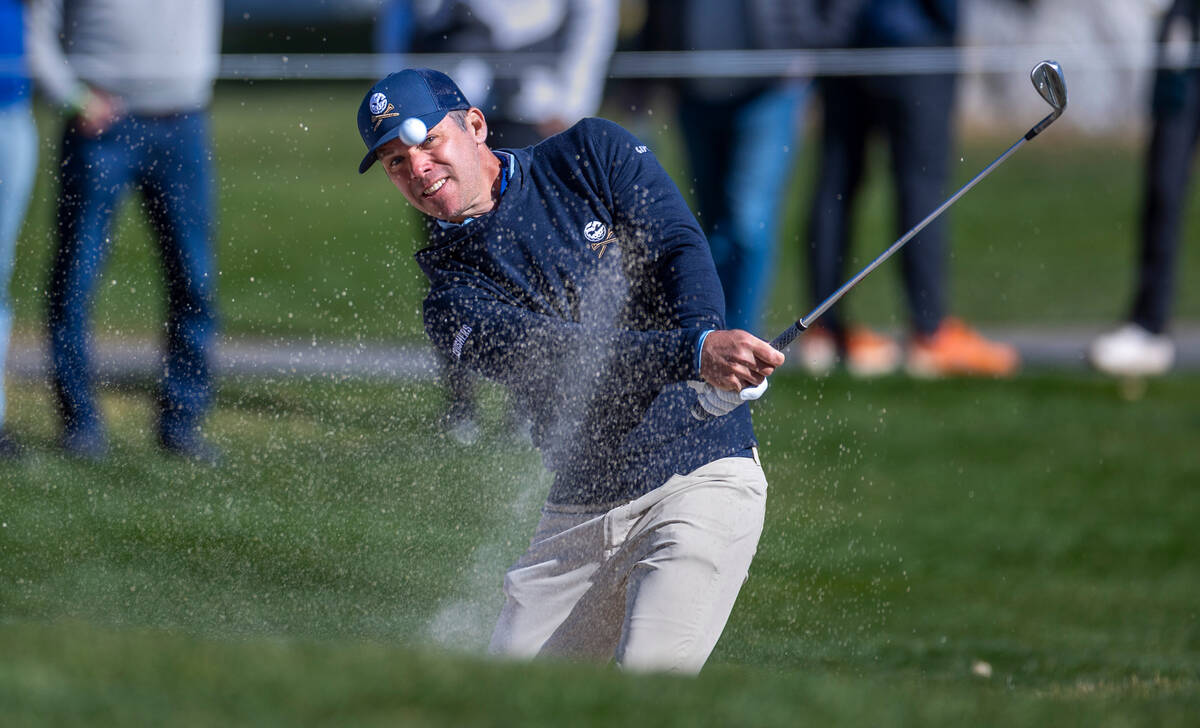 Paul Casey hits the ball from a sand trap on hole #15 during the final round of the LIV Golf to ...