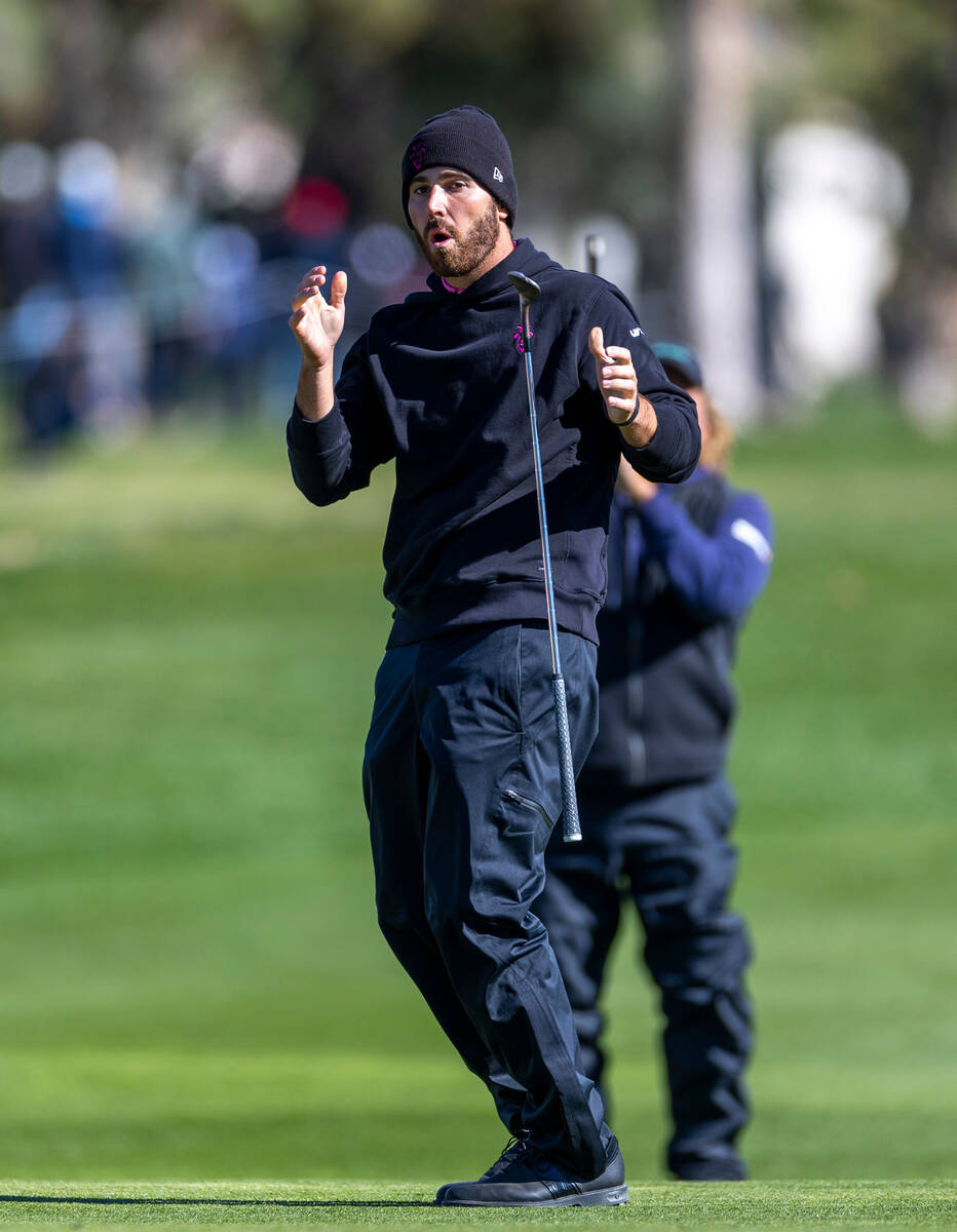 Matthew Wolff reacts to a near sinking as he chips the ball onto the green at hole #15 during t ...