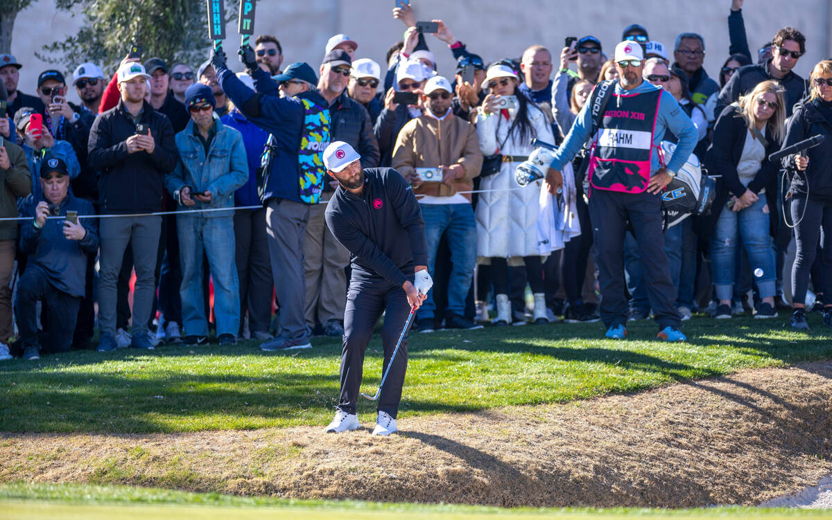 Jon Rahm chips onto the green at hole #16 during the final round of the LIV Golf tournament at ...
