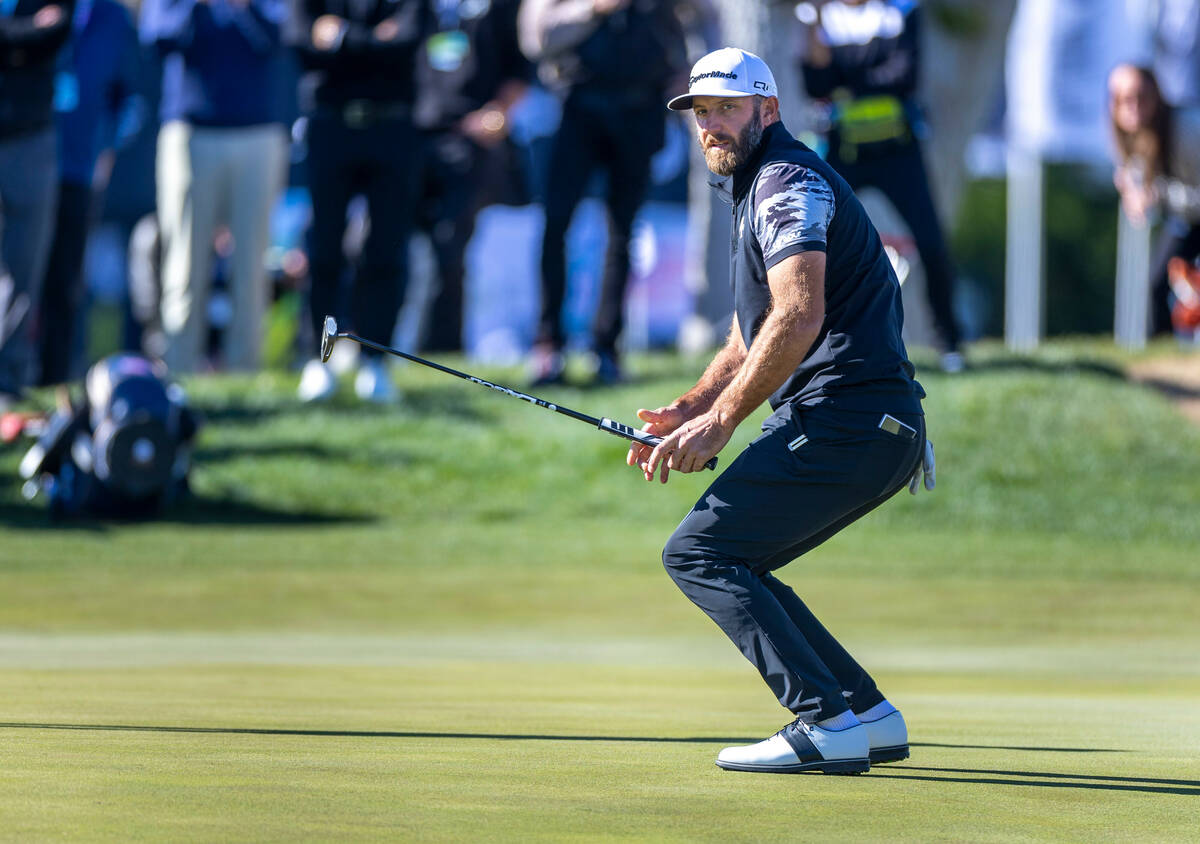 Dustin Johnson nearly misses his birdie putt on the green at hole #16 during the final round of ...