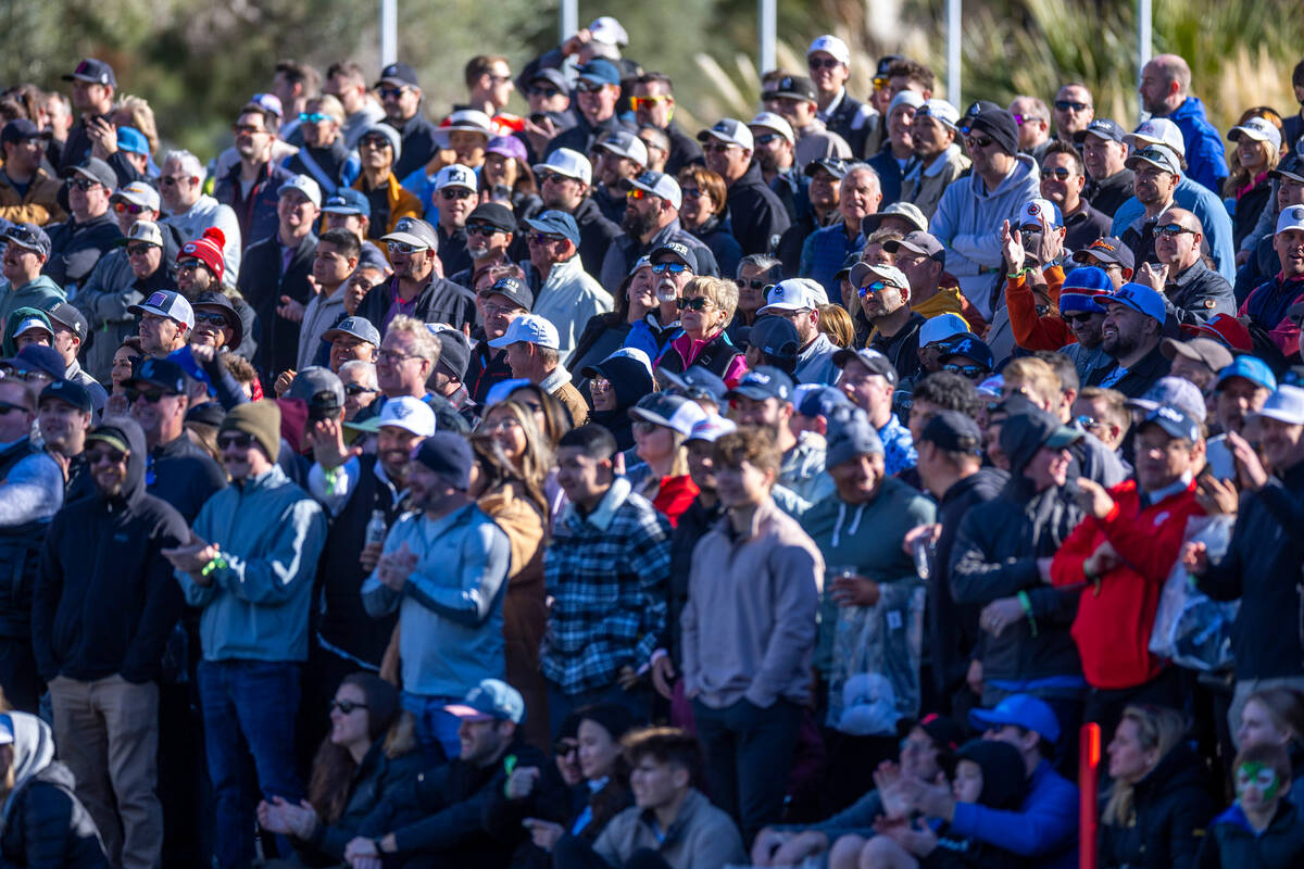 The crowd gathers for the finish about hole #18 during the final round of the LIV Golf tourname ...