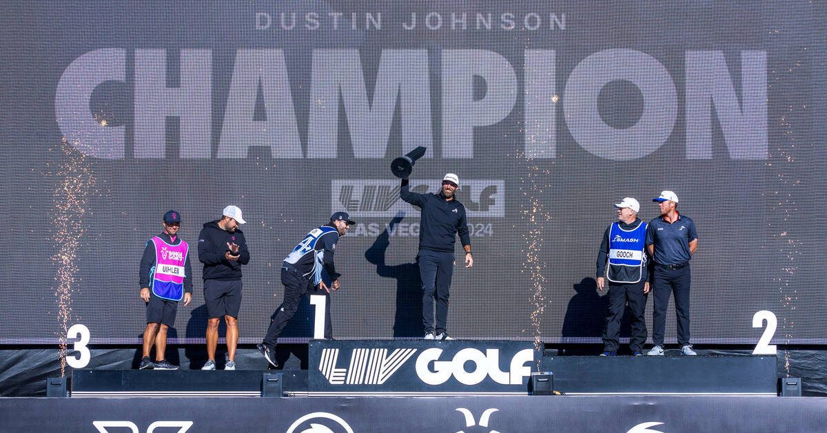 Dustin Johnson celebrates his win with a trophy during the final round of the LIV Golf tourname ...