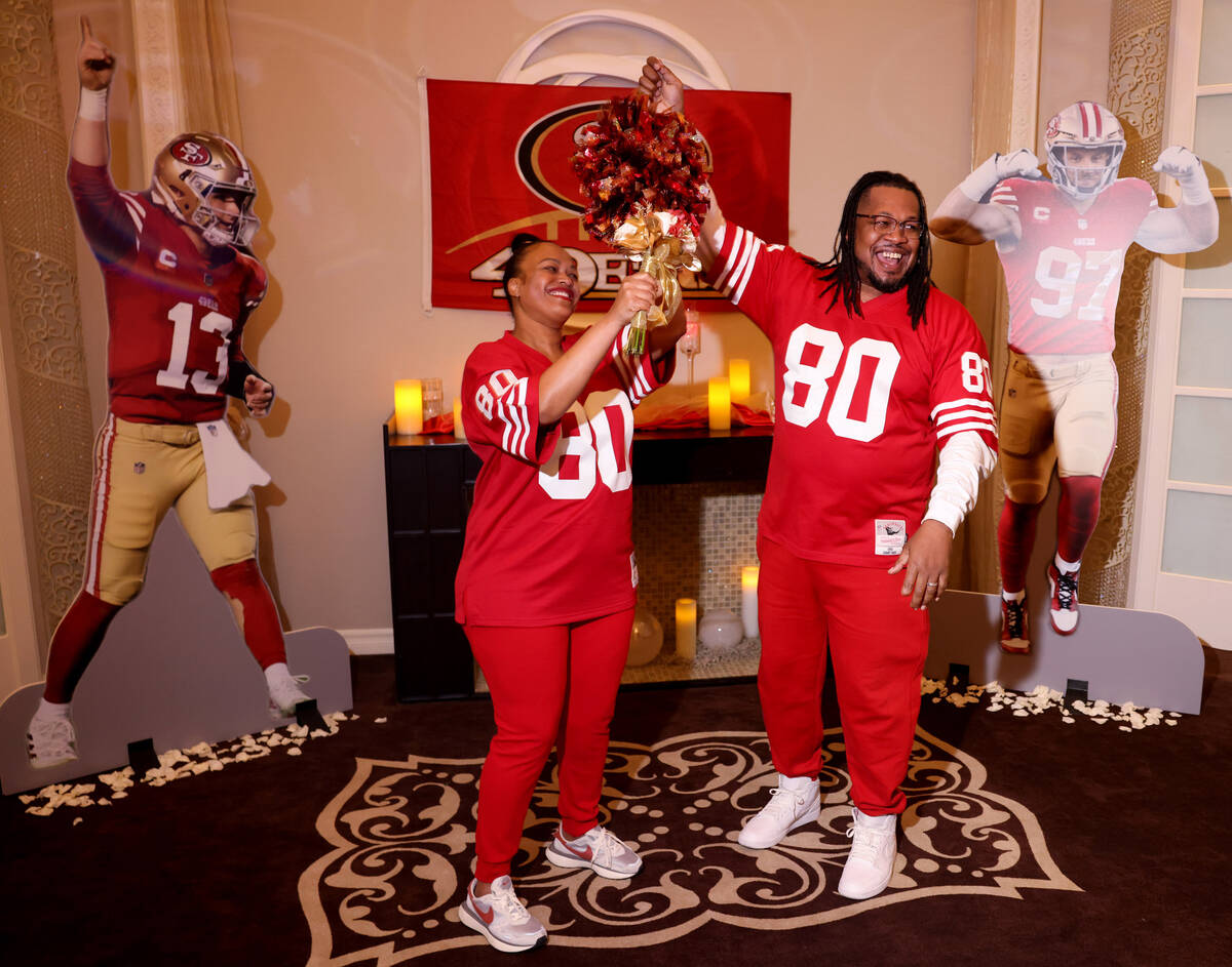 Kevin and Nicole Crockrom of Las Vegas celebrate after renewing their wedding vows in a 49ers-t ...