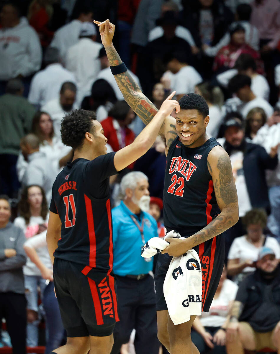 UNLV's Karl Jones, right, and Dedan Thomas Jr. celebrate after beating New Mexico 80-77 in an N ...