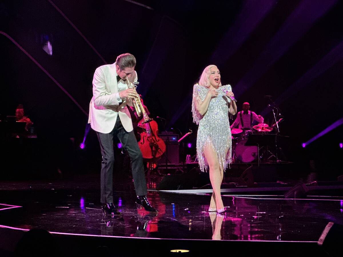Brian Newman and Lady Gaga are shown at "The Dinner Show" Super Bowl party hosted by Mark Davis ...