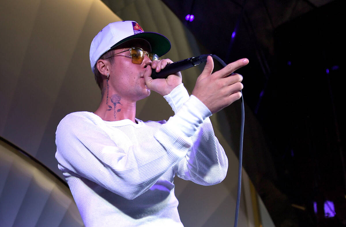 Justin Bieber performs onstage during h.wood Group's grand opening of Delilah at Wynn Las Vega ...