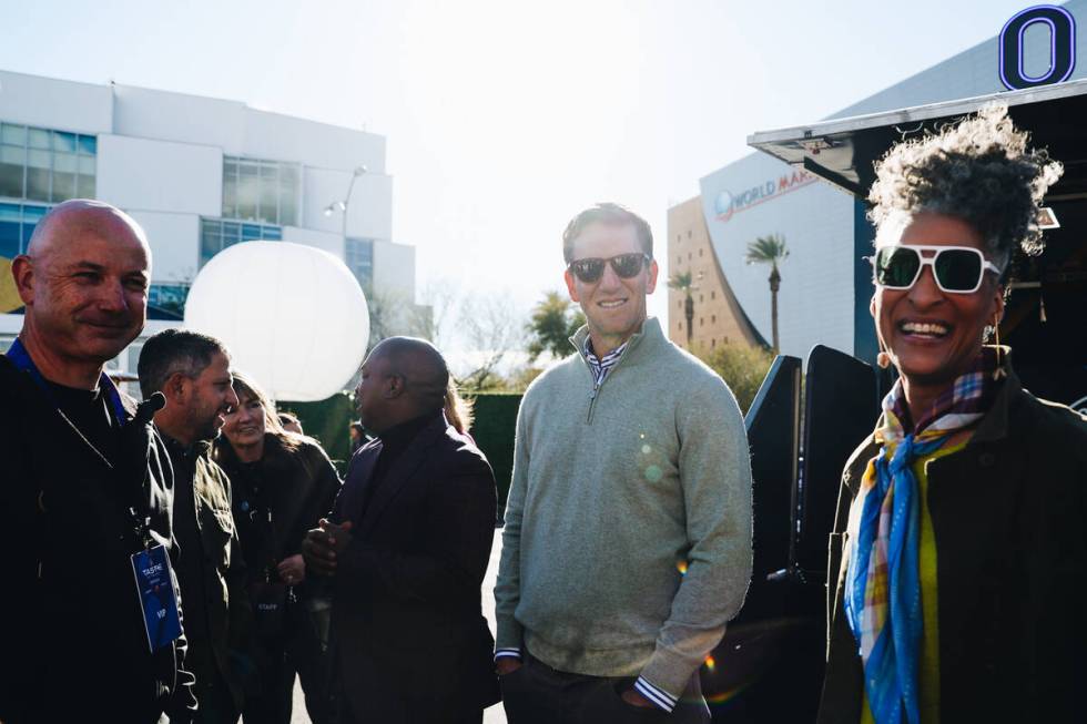 Former NFL quarterback Eli Manning, middle, converses with a group at the Taste of NFL event at ...