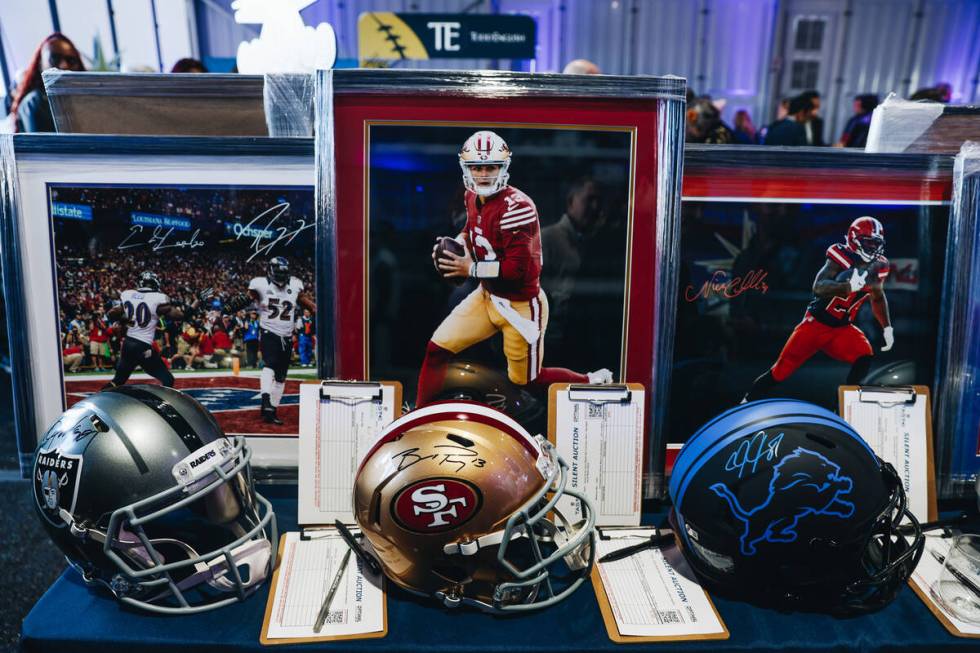 A helmet signed by San Francisco 49ers quarterback Brock Purdy is seen during a silent auction ...