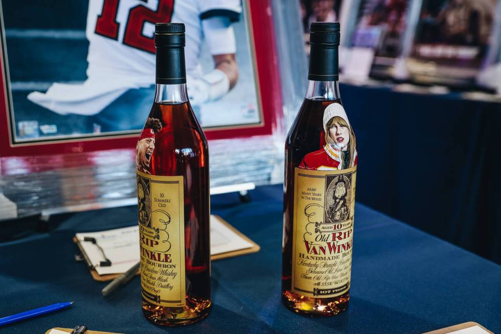 Kansas City Chiefs quarterback Patrick Mahomes and Taylor Swift are seen on bourbon bottles up ...