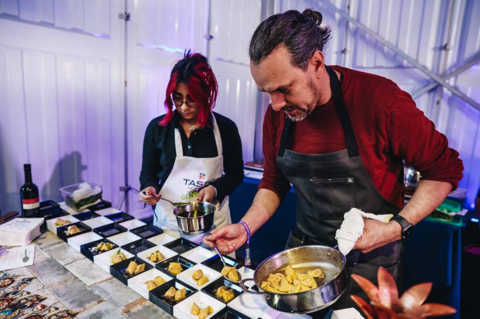 Chefs from Esther’s Kitchen put out for for attendees at the Taste of NFL event at the K ...