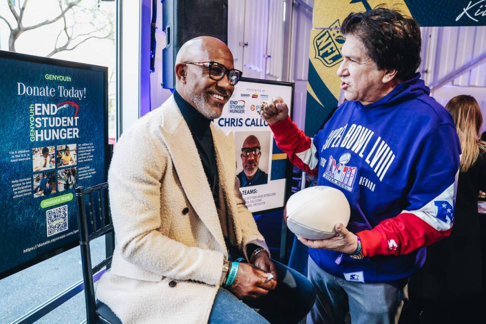 Former NFL wide receiver Chris Calloway converses with a fan at the Taste of NFL event at the K ...