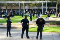 Houston Police officers watch over displaced churchgoers outside Lakewood Church, Sunday, Feb. ...
