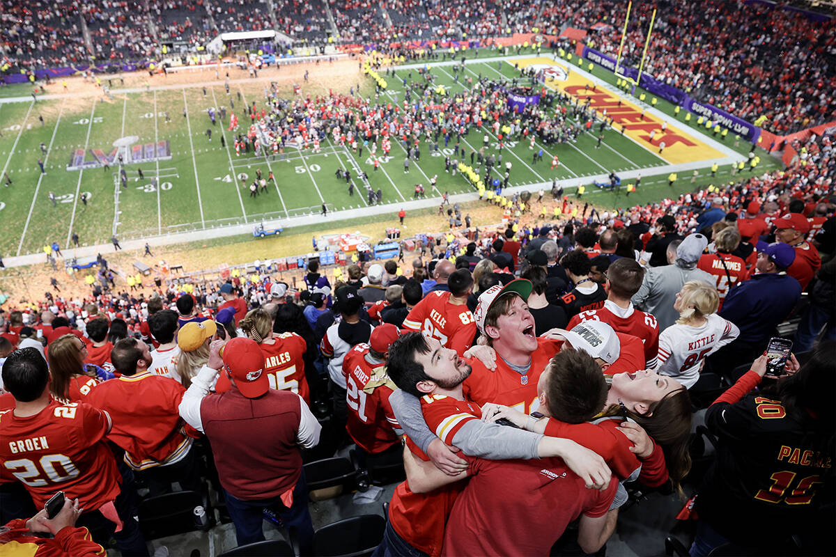 A group of Kansas City Chiefs fans embraces after their team won their second consecutive NFL S ...
