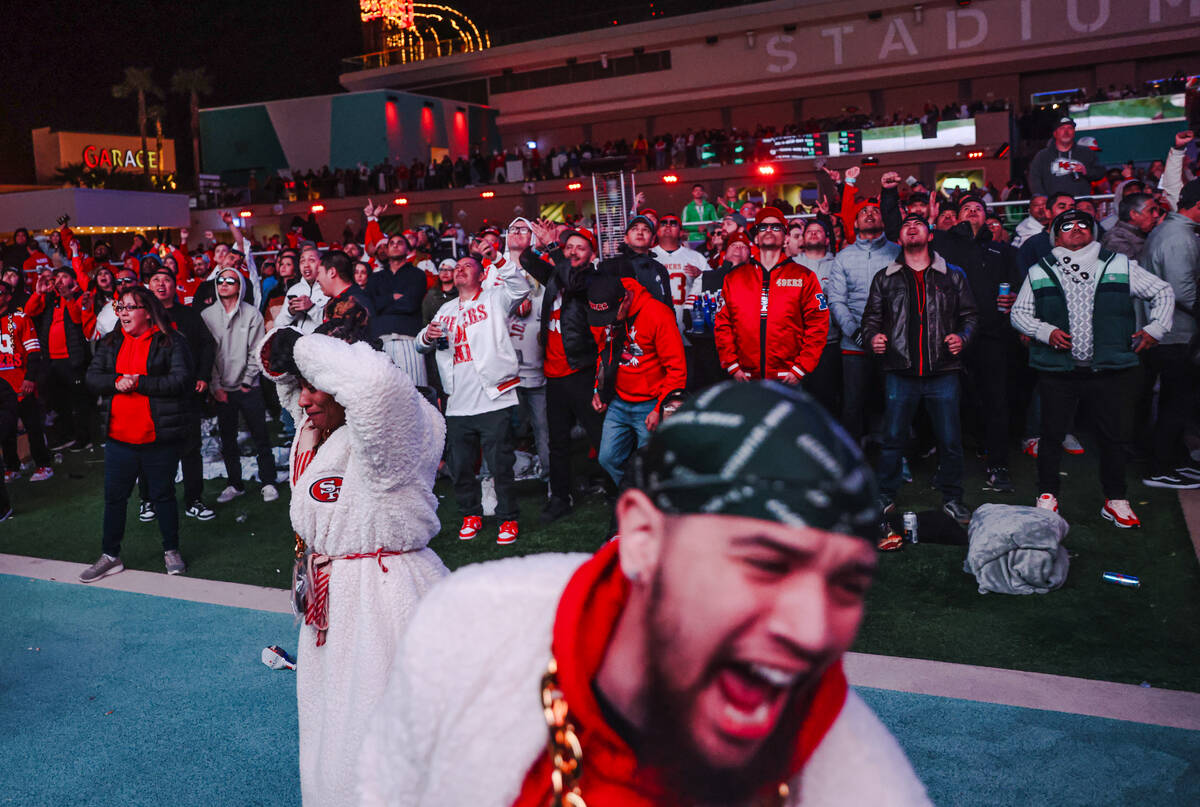 San Francisco 49ers fans cheer while watching Super Bowl LVIII at Circa Swim in Las Vegas, Sund ...