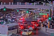 A downed light pole holds up traffic on Las Vegas Boulevard South and Flamingo Road on Super Bo ...