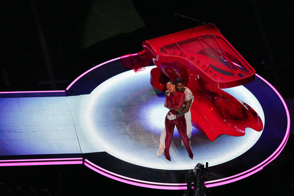 Usher, right, and Alicia Keys perform during halftime of the NFL Super Bowl 58 football game be ...