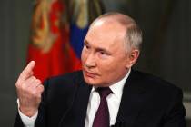 In this photo released by Sputnik news agency on Friday, Feb. 9, 2024, Russian President Vladim ...