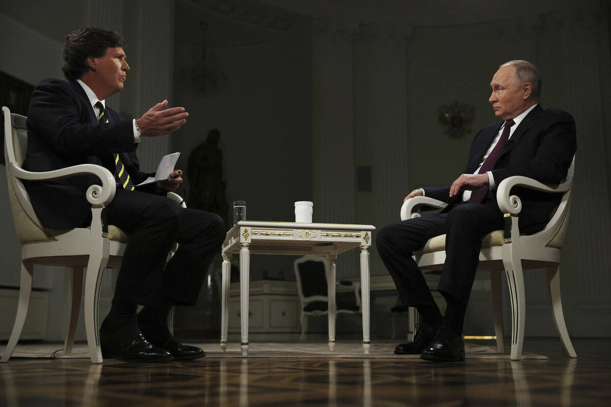 In this photo released by Sputnik news agency on Friday, Feb. 9, 2024, Russian President Vladim ...