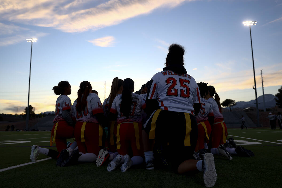 Las Vegas kneels during halftime of a Class 5A state quarterfinal flag football playoff game ag ...