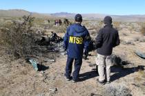 An NTSB investigator at the site of the Feb. 9, 2024, crash of an Airbus Helicopters EC-130 nea ...