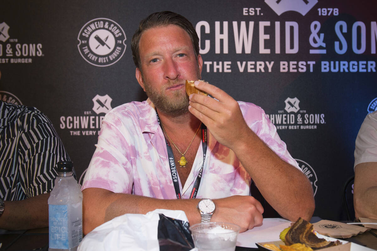 Dave Portnoy eats a hamburger at Burger Bash during the South Beach Wine and Food Festival on F ...