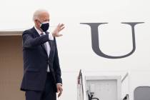 President Joe Biden waves from the top of the steps of Air Force One. (AP Photo/Susan Walsh)