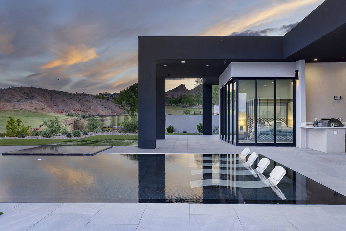 The Southern Highlands home has a resort-style pool and offers sweeping views of the desert mou ...