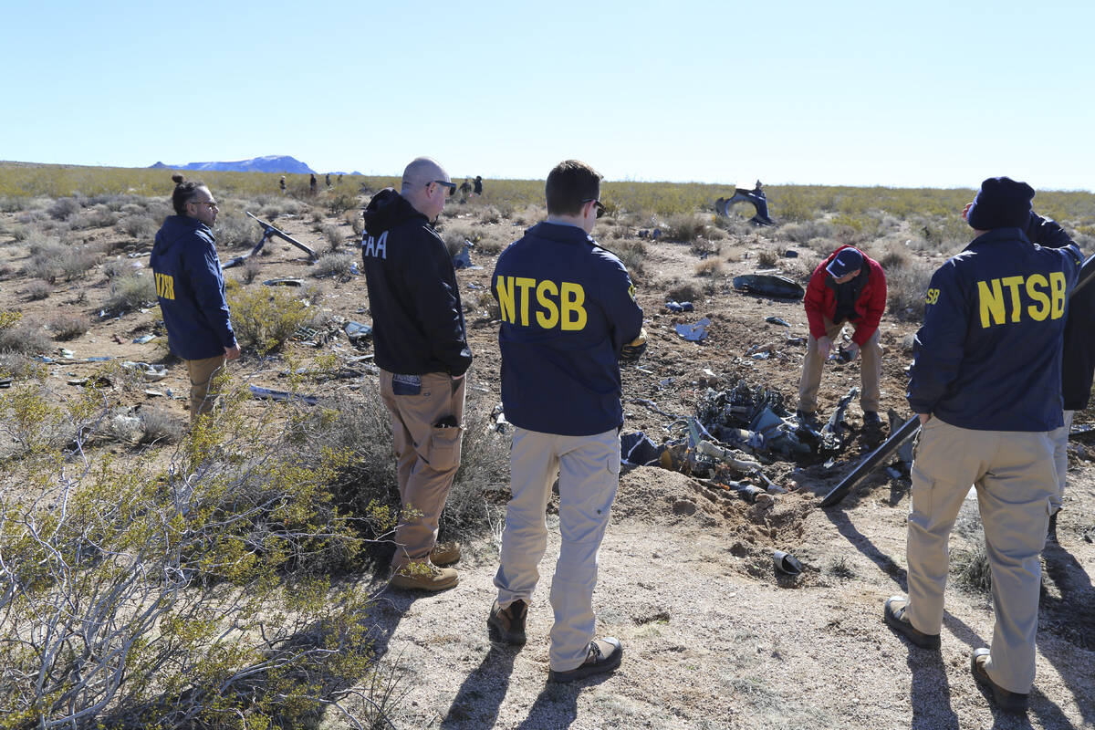 NTSB investigators survey the site of an Airbus Helicopters EC-130 on Sunday, Feb. 11, 2024, ne ...